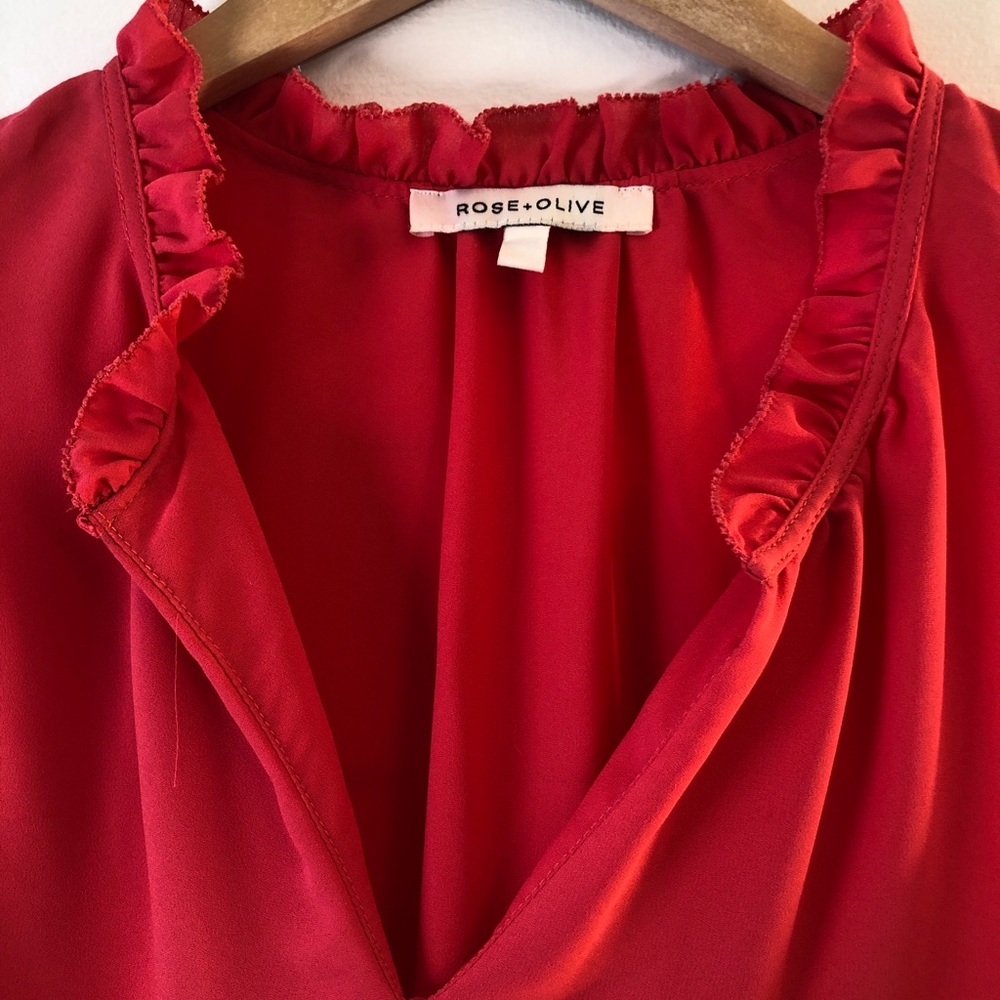 Coral pink frilly blouse